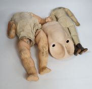 A quantity of bisque doll heads, bodies and limbs