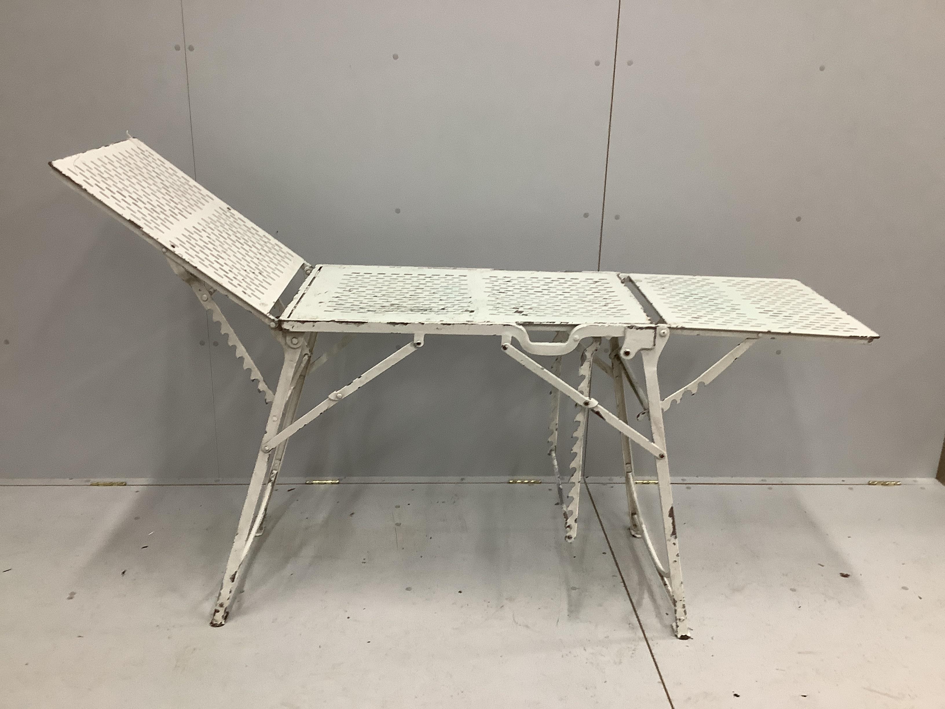 A vintage metal doctor's examination table