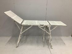 A vintage metal doctor's examination table