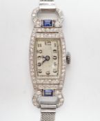 A lady's mid 20th century white metal (Swiss platinum mark), sapphire and diamond cluster set manual
