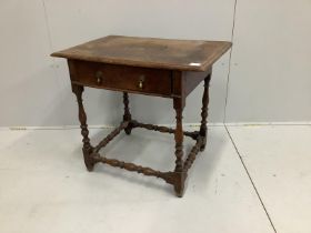 An 18th century rectangular oak side table with planked top and single drawer raised on turned