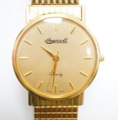 A gentleman's modern 9ct gold Ingersoll quartz wrist watch, on a steel and gold plated flexible