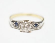 An 18ct and single stone diamond ring, with sapphire set shoulders, size N, gross weight 3.6 grams.