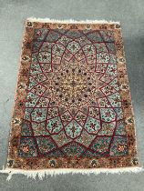 A North West Persian peach ground rug, 140 x 100cm