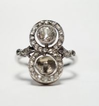 A 1920's white metal, diamond and pearl? set up finger ring, with diamond set borders and diamond