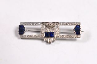 A 1980's Art Deco style Garrard 18ct white gold, sapphire and diamond cluster set bar brooch,