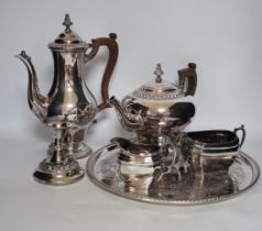 A large quantity of plated wares including a four piece tea and coffee set, other plated wares and