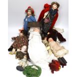 Nine assorted dolls including AMS and Kewpie small doll baby in cradle