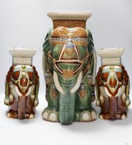 A pair and another elephant and howdah garden seats, largest 43cm