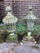 A pair of stone garden urn ornaments, height 100cm
