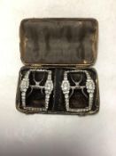 A cased pair of Georgian white metal, steel and white paste cluster set shoe buckles, 58mm, in