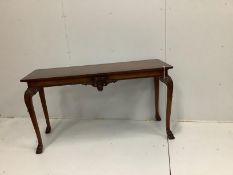 A reproduction George III style mahogany console table, with carved frieze, on cabriole legs, length