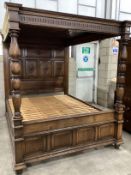 A 17th century style oak four poster bed, width 169cm, height 198cm