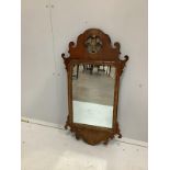 A George III style walnut fret cut wall mirror with Prince of Wales Feathers, width 42cm, height
