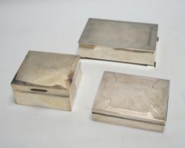 Three assorted silver mounted cigarette boxes including two 1930's, one by Goldsmiths & Silversmiths