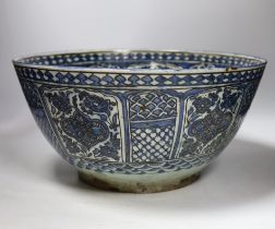 A large Persian underglaze blue and black fritware bowl, Safavid, 17th/18th century 40cm diameter,