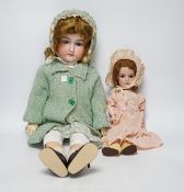 An AM390 bisque head doll, 63cm good condition, and an AM390, missing two fingers and wear on