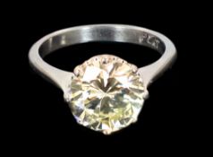 A platinum and solitaire diamond set ring, the round cut stone weighing approximately 2.50ct, with
