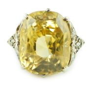A mid 20th century platinum? and single stone fancy cushion cut yellow sapphire set dress ring