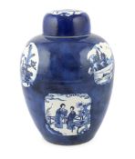 A large Chinese powder blue jar and cover, Kangxi period, painted to shaped reserves in underglaze