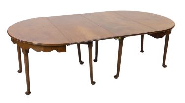 A George II mahogany extending dining table, with two single drop leaf D ends and serpentine aprons,