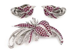 A suite of platinum?, diamond and ruby set cluster jewellery, comprising a spray brooch and pair