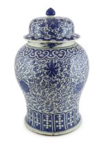 A massive Chinese blue and white ‘lotus’ vase and cover, 18th/19th century, the shoulder with