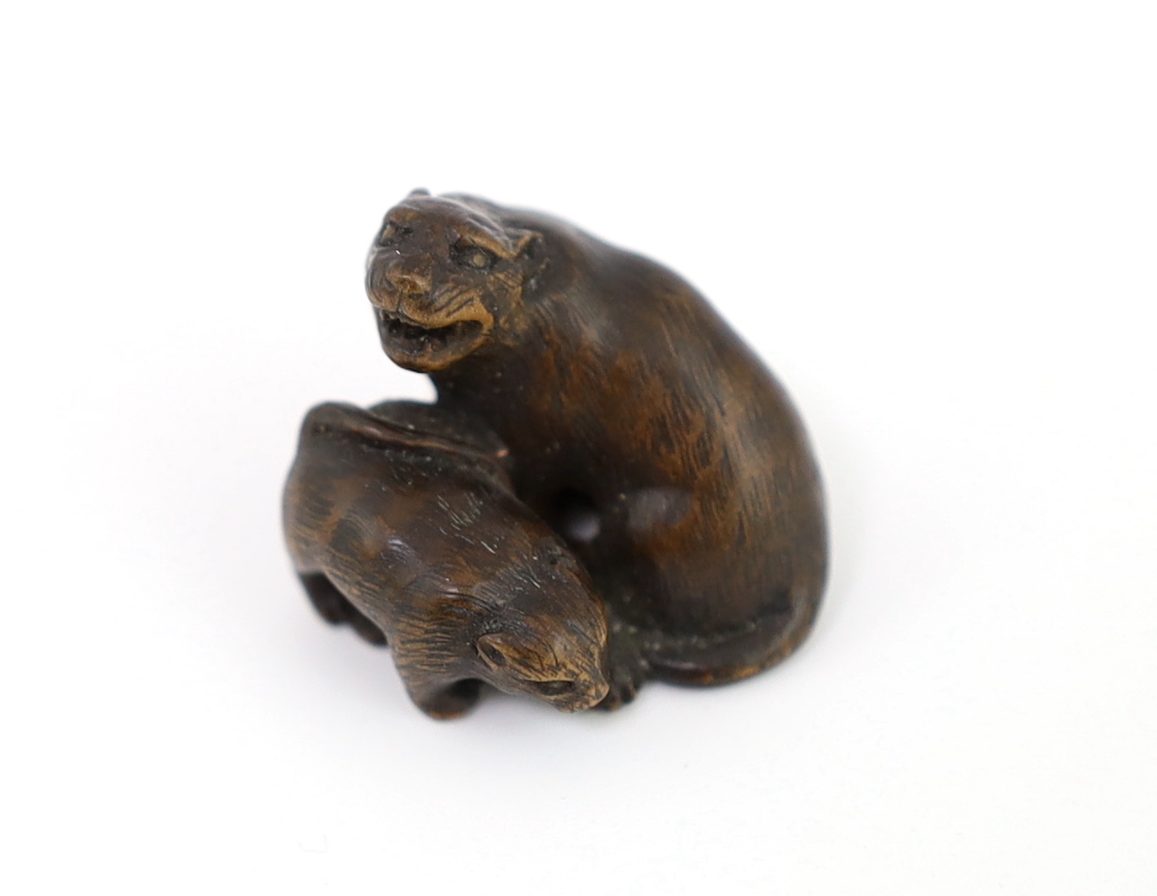 * A Japanese carved wood netsuke of a tiger and cub, 19th century, unsigned, 2.2cmProvenance: J. - Image 2 of 5