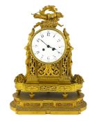 A 19th century French Louis XVI style ormolu mantel clock, with torch, bow and quiver finial over