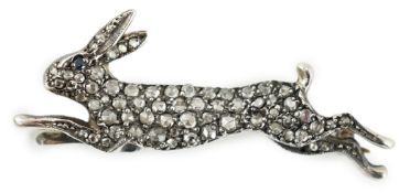 An Edwardian gold, silver and rose cut diamond cluster set hare brooch, with sapphire set eye, 39mm,