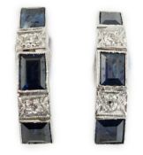 A pair of 9ct white gold, three stone sapphire and two stone diamond set half hoop ear clips,