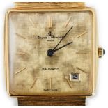 A gentleman's 1980's 18ct gold Baume & Mercier Baumatic dress wrist watch, the textured dial with