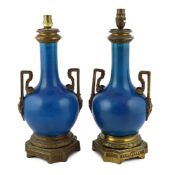 A pair of Chinese or Japanese turquoise-glazed bottle vases with Louis XVI style ormolu lamp mounts,