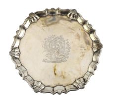 A George II silver salver, by John Robinson II, of shaped circular form with shell and scroll border