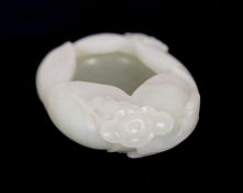 * A Chinese pale celadon jade waterpot, 17th/18th century, formed as overlapping petals and worked