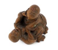 * A Tokyo School carved wood netsuke of two boys fighting, 19th century, signed Kakiman, one boy