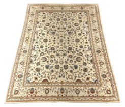 * A Kashan ivory ground carpet, central field of foliate motifs, multi bordered, 400 x 308cmPlease