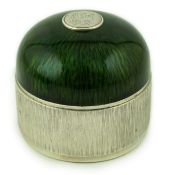 An Elizabeth II textured silver and green enamelled circular box and cover by Adrian Gerald