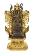 A Burmese gilt bronze seated figure of Jambupati Buddha on a throne, Shan, 17th-18th century, in