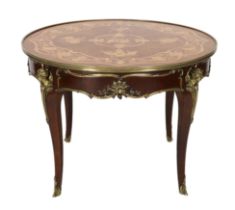 A Louis XVI style ormolu mounted marquetry centre table, decorated with musical, agricultural and