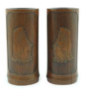 A pair of Chinese inscribed 'Damo' bamboo brushpots, 19th century, each carved in relief with the