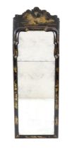 A William and Mary cushion framed lacquer pier mirror, the shaped crest decorated with a Chinoiserie