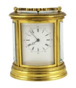 * A late 19th century French brass oval cased eight day hour repeating carriage clock, by Henri