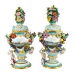A pair of Meissen topographical flower encrusted vases and covers, 19th century, each painted with