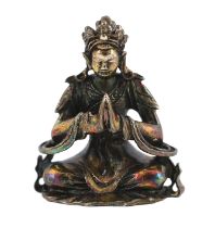* A Chinese miniature silver figure of a Bodhisattva, 18th/19th century, seated in prayer,