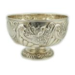 A late Victorian repousse silver rose bowl, by William Hutton & Sons, decorated with foliage and