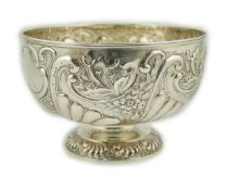 A late Victorian repousse silver rose bowl, by William Hutton & Sons, decorated with foliage and