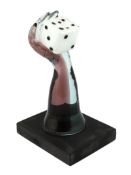 ** A Murano Vetreria amethyst glass arm, holding a white, black spotted, dice in hand, signed,