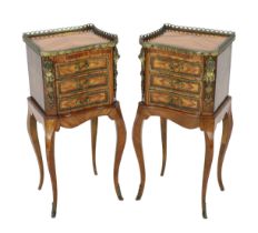A pair of Louis XVI style ormolu mounted kingwood bedside chests, each of asymmetrical scroll form