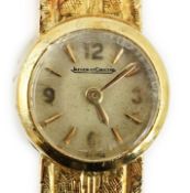 A lady's 18ct gold Jaeger LeCoultre manual wind wrist watch, with baton and quarterly Arabic